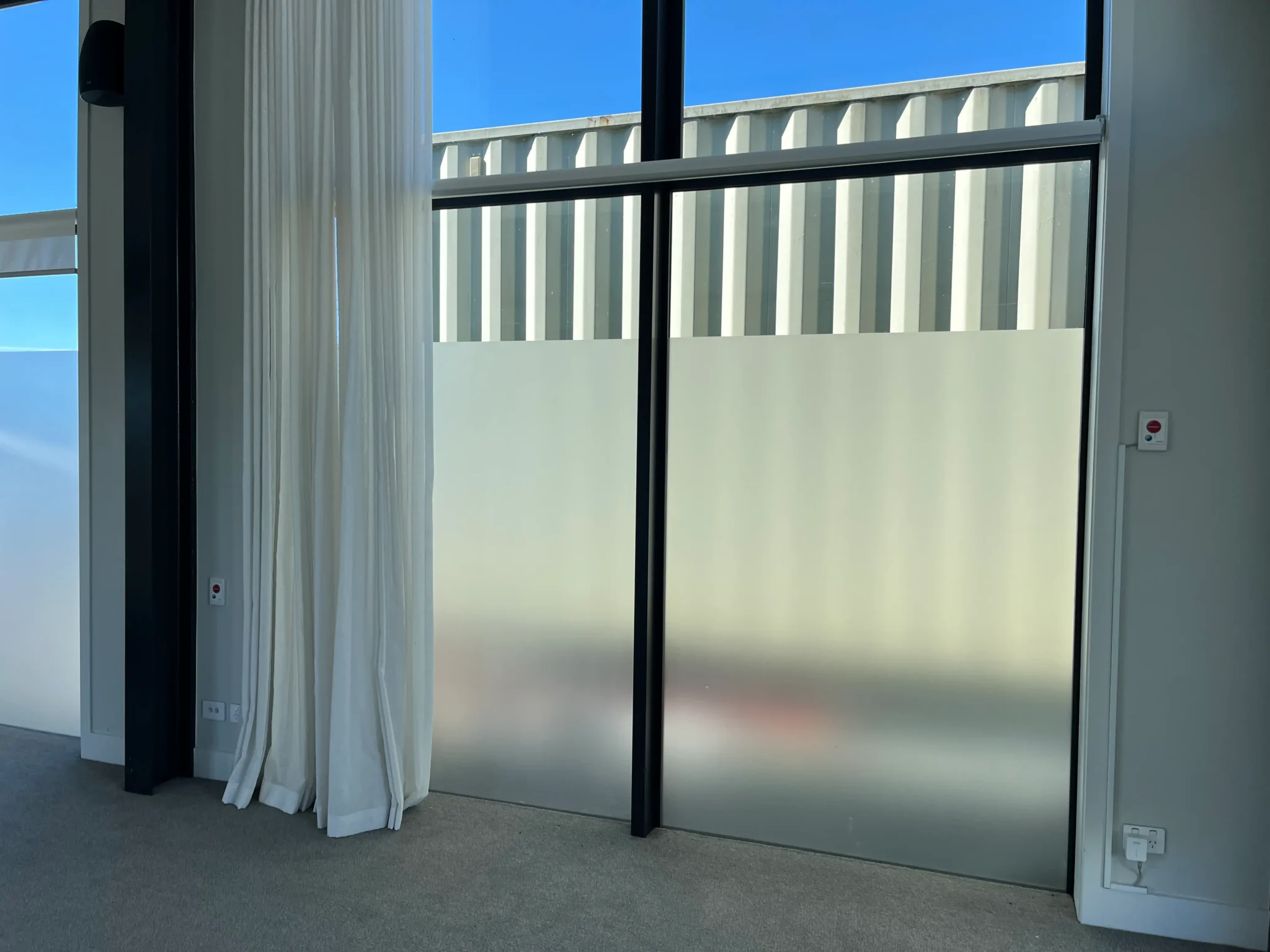 Protective glass film installation for Mairangi Bay properties