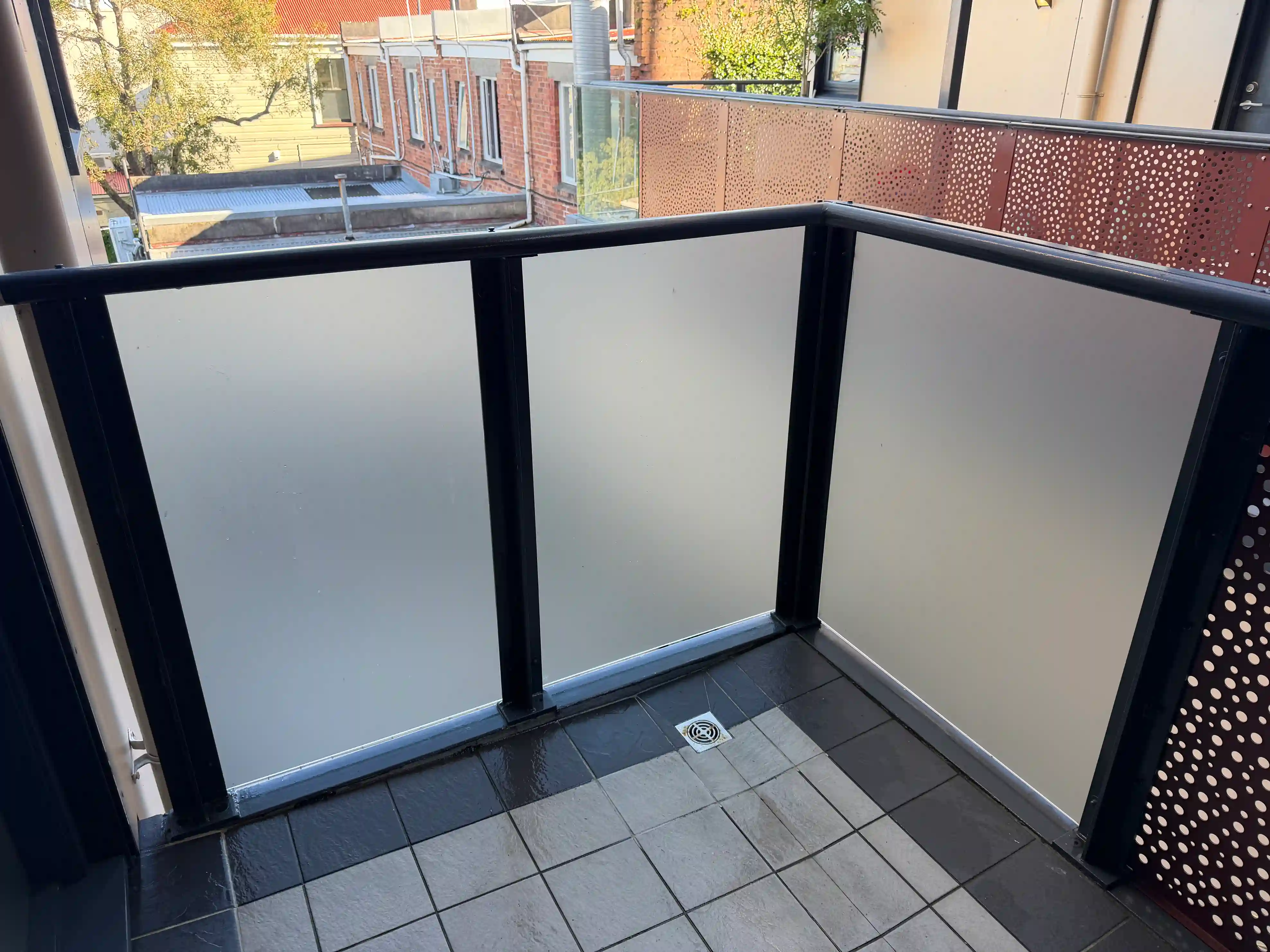 Protective glass film installation for Eastern Beach commercial properties