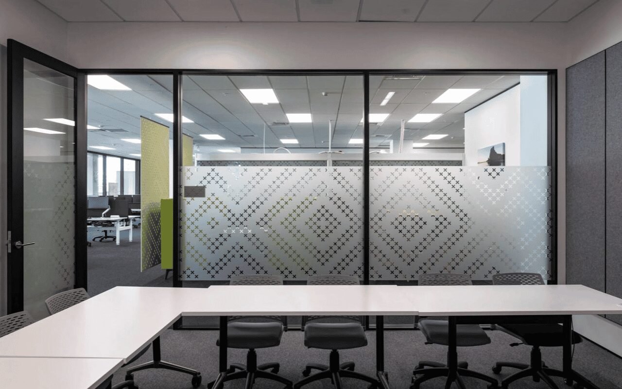 Office meeting room with frosted glass partitions providing visual privacy